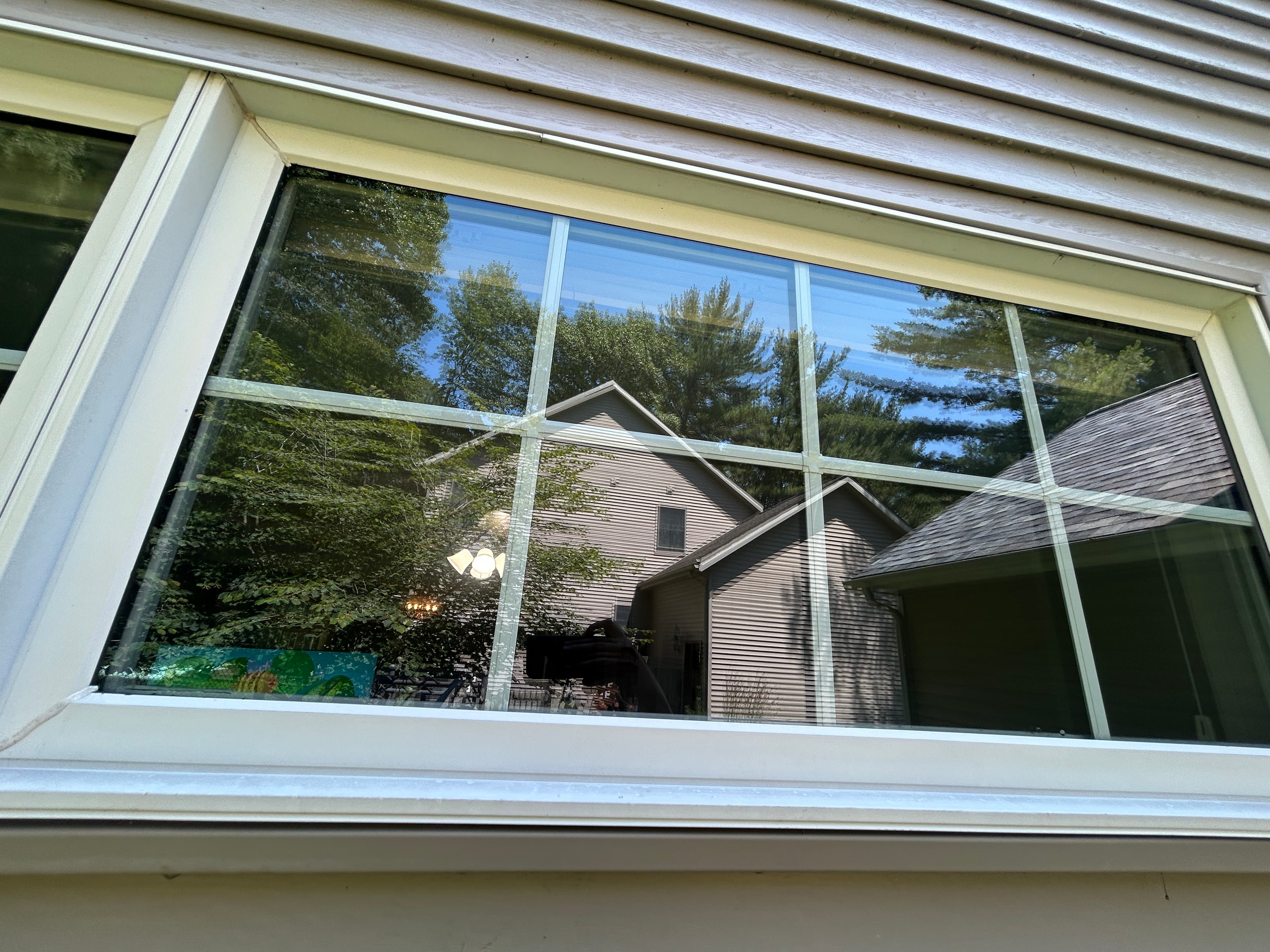 Same window fully clear and spot-free after hard water spot removal